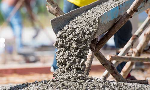 Concrete pouring during commercial concreting floors of building